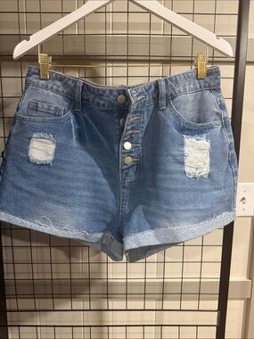 High-Rise Distressed Denim Shorts in Light Blue